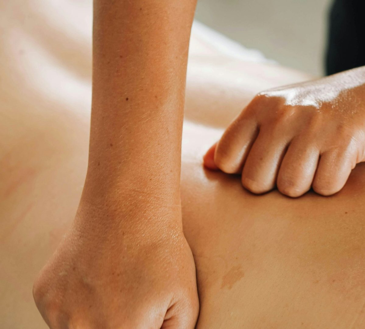 Back massage Massage therapist working on a client's back.